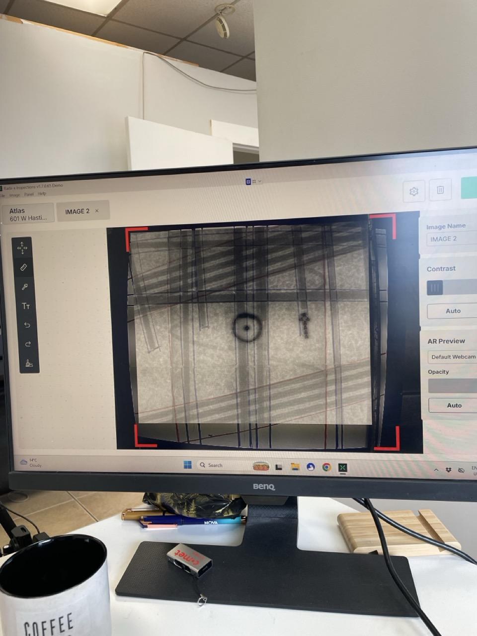 A larger desktop monitor showing the Radii-x AR Preview interface: the live camera feed of the slab is overlaid with the X-Ray image at about 80% opacity, with the opacity slider on the right used to slide between full image and full slab to verify nothing was missed