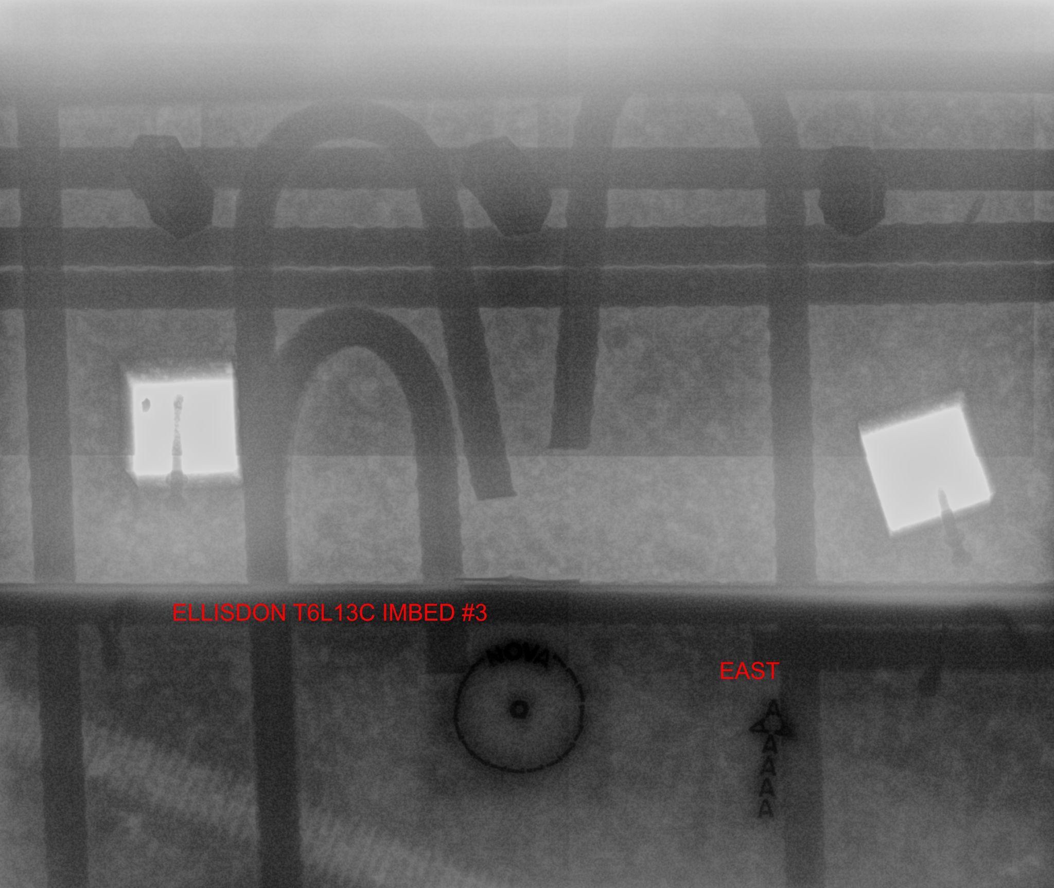 Digital concrete X-Ray radiograph of an edge zone with embed plates, hooked rebar, and dense reinforcement — labeled ELLISDON T6L13C IMBED #3 with an EAST orientation marker