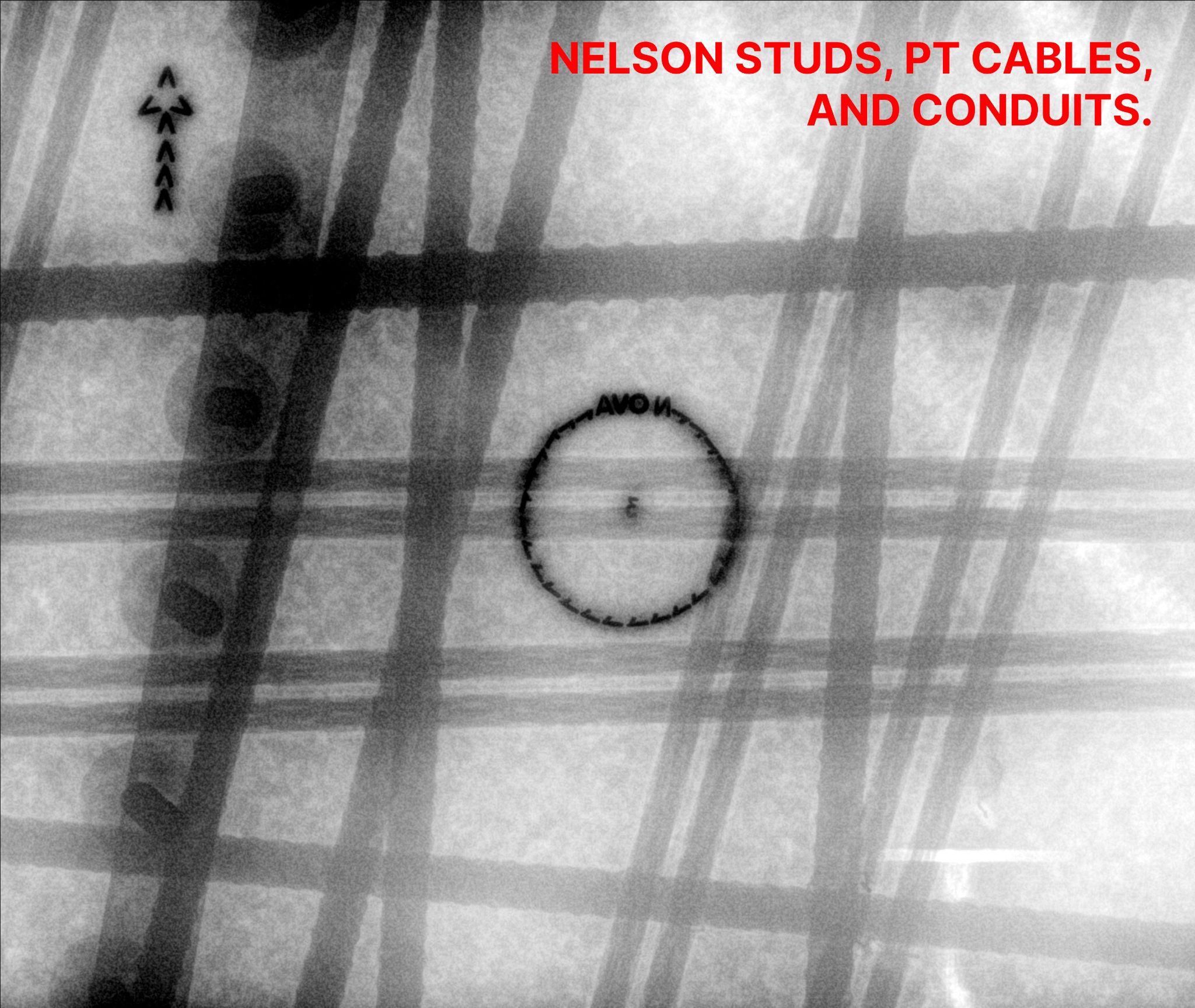 Digital concrete X-Ray radiograph showing Nelson studs, PT cables, and conduits crossing in a congested slab — with the marked coring circle sitting clear of the cable paths